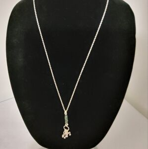 🇨🇦Sterling silver necklace with green and black stones.